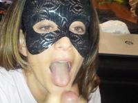 Beauty in a mask has fun with a cock