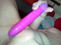 Babe with shaved pussy plays with sex toy
