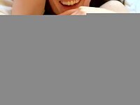 Her smile disappears as I fill her hole with my cum