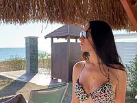 Naughty girl sucks cock, risking being caught on the beach