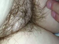 Fingering her hairy snatch