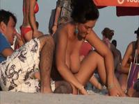 Bouncing breasts on the beach