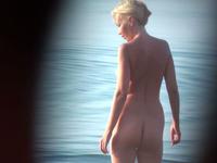 Adorable nude babe on the beach