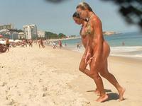 Sexy babes in tiny bikinis get spied on hidden camera when walking out of the warm sea