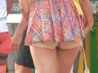 The hot shorts of this gal are so tiny that you can hardly see them under her long top