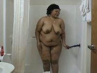 Big black babe taking a shower