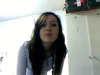 Hot brunette strips on webcam